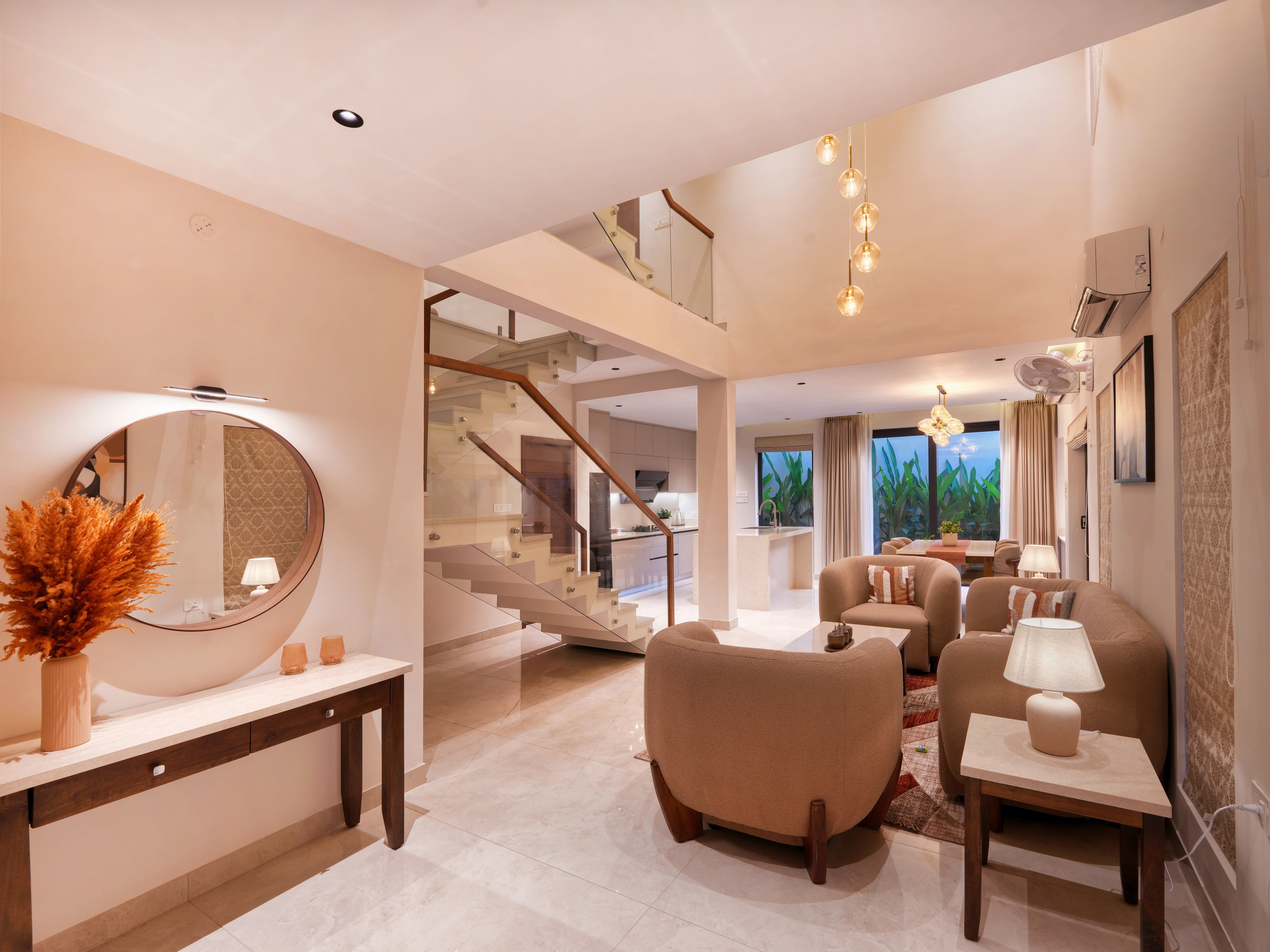 Villa Vesper living space with rattan lighting and lush greenery